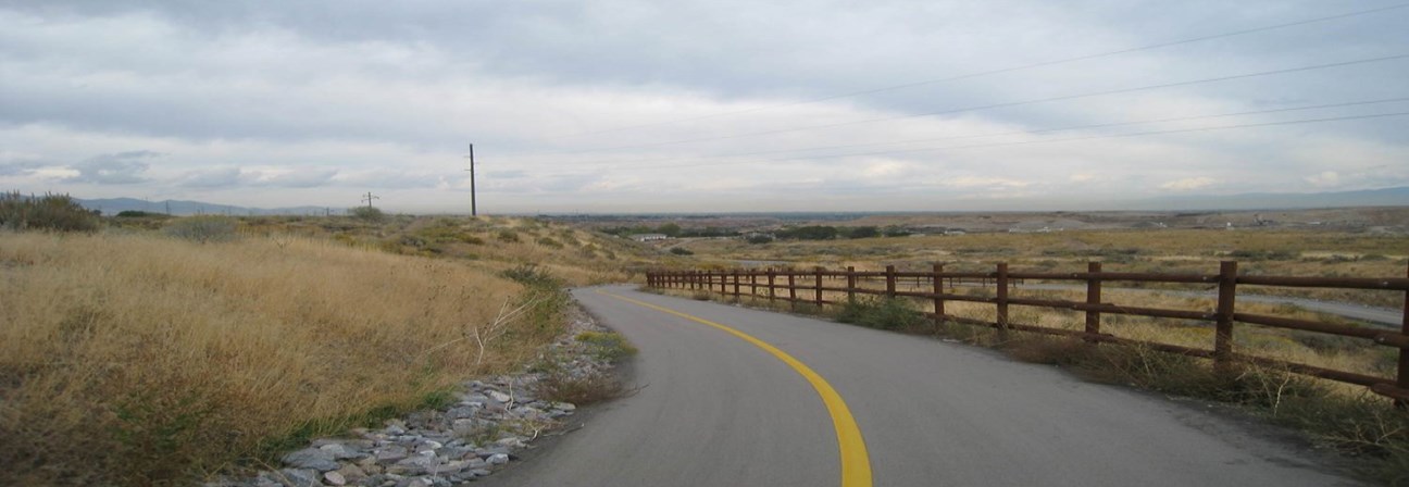 A road with a fence along it.