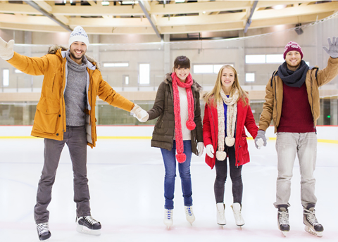 A group of people ice skating.