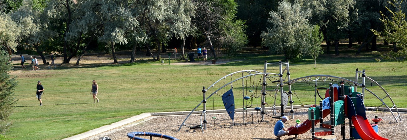 A group of people playing on a playground.